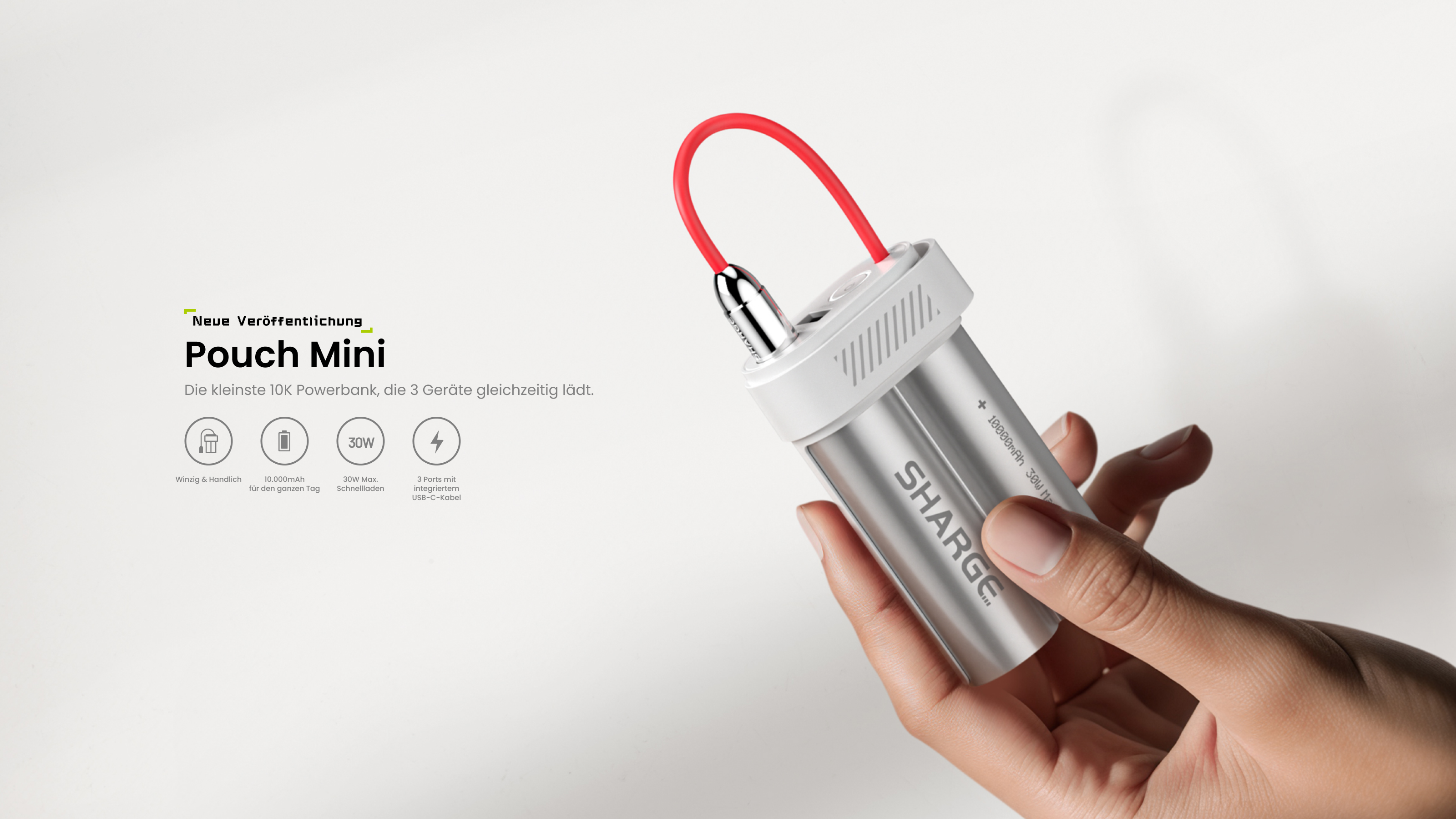 {"default":"Eine Hand hält eine Pouch Mini-Powerbank"}