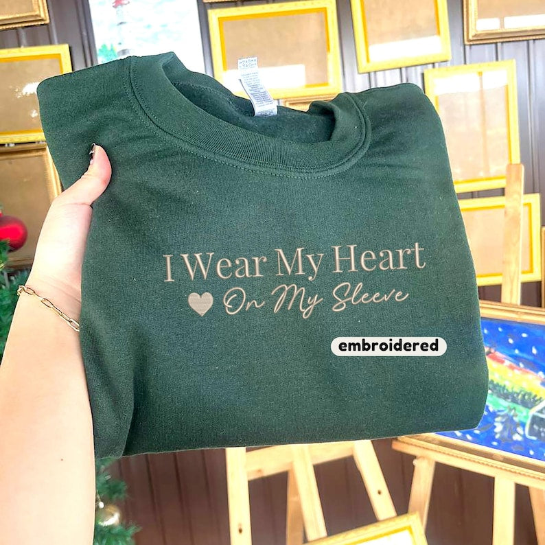 Embroidered I Wear My Heart On My Sleeve Sweatshirt, Custom Mama Sweatshirt with Kids Name on Sleeve, Christmas Mother Day Gift for Mom-ilovevango