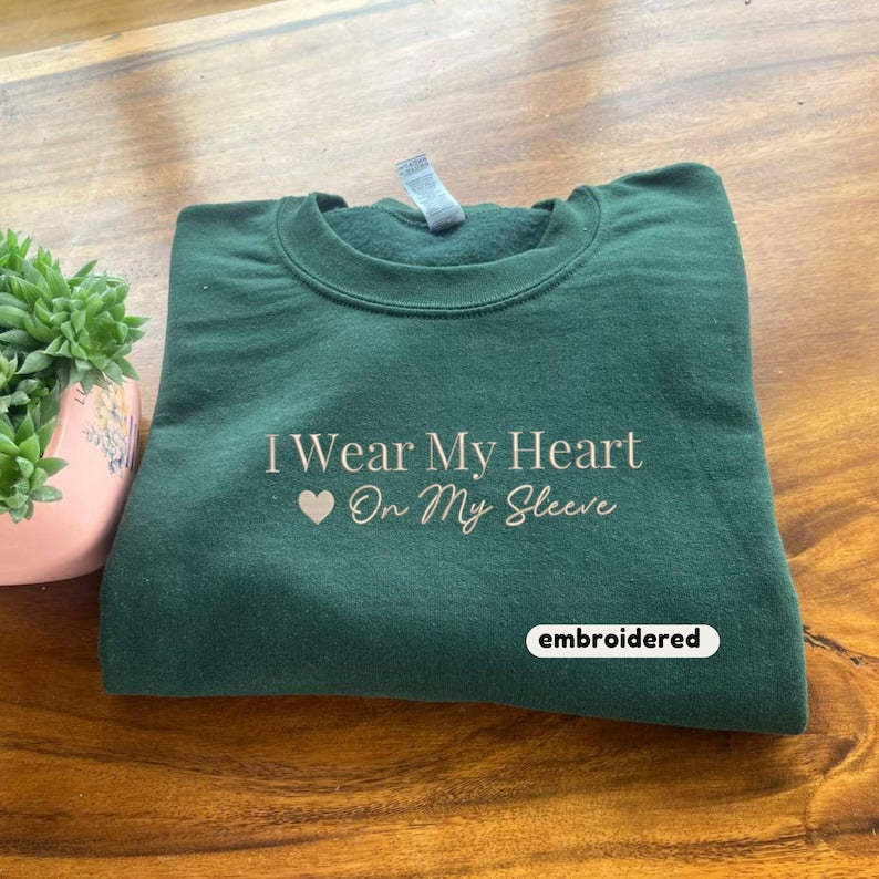Embroidered I Wear My Heart On My Sleeve Sweatshirt, Custom Mama Sweatshirt with Kids Name on Sleeve, Christmas Mother Day Gift for Mom-ilovevango