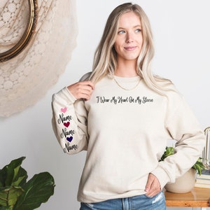 I Wear My Heart On My Sleeve Sweatshirt and Hoodie, Custom Family Gift Hoodie, Gift for Mom, Custom Mama Sweatshirt with Name on Sleeve-ilovevango