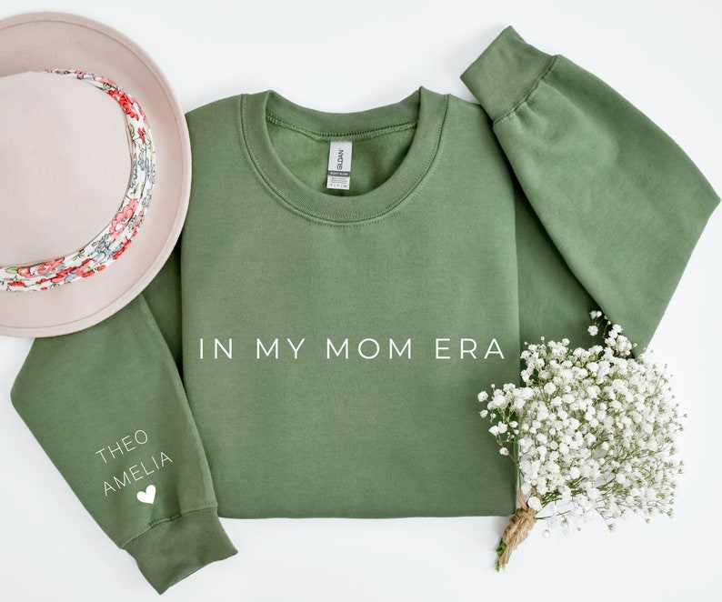 In My Mom Era With Kid Name On Sleeve Sweatshirt, Mama Sweatshirt, Mama shirt, Gift For Mom, Mother Day Gift, Mom Life Shirt, Mama Crewneck-ilovevango