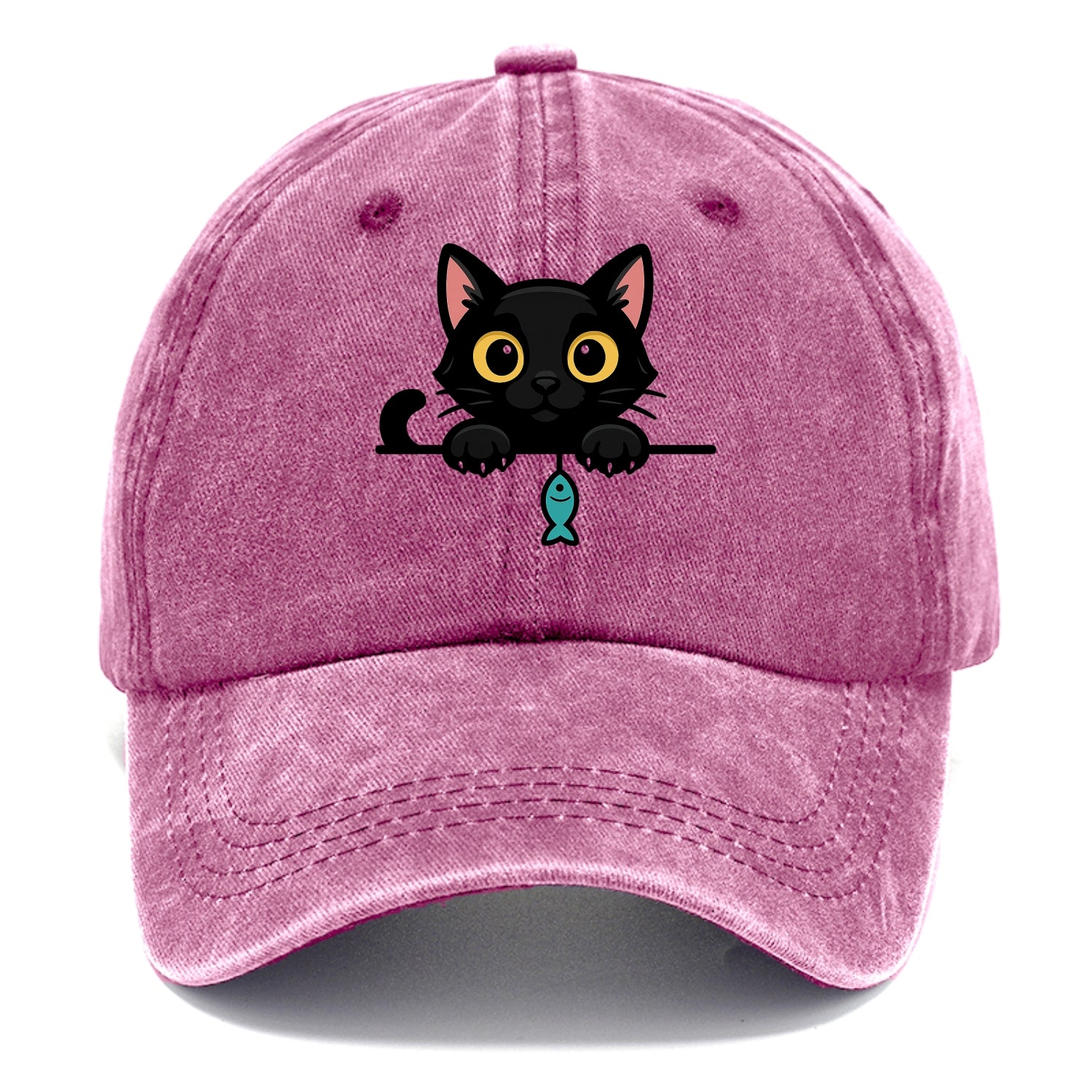Midnight the black cat holding a tiny yarn ball between both paws while peeking Washed Cap