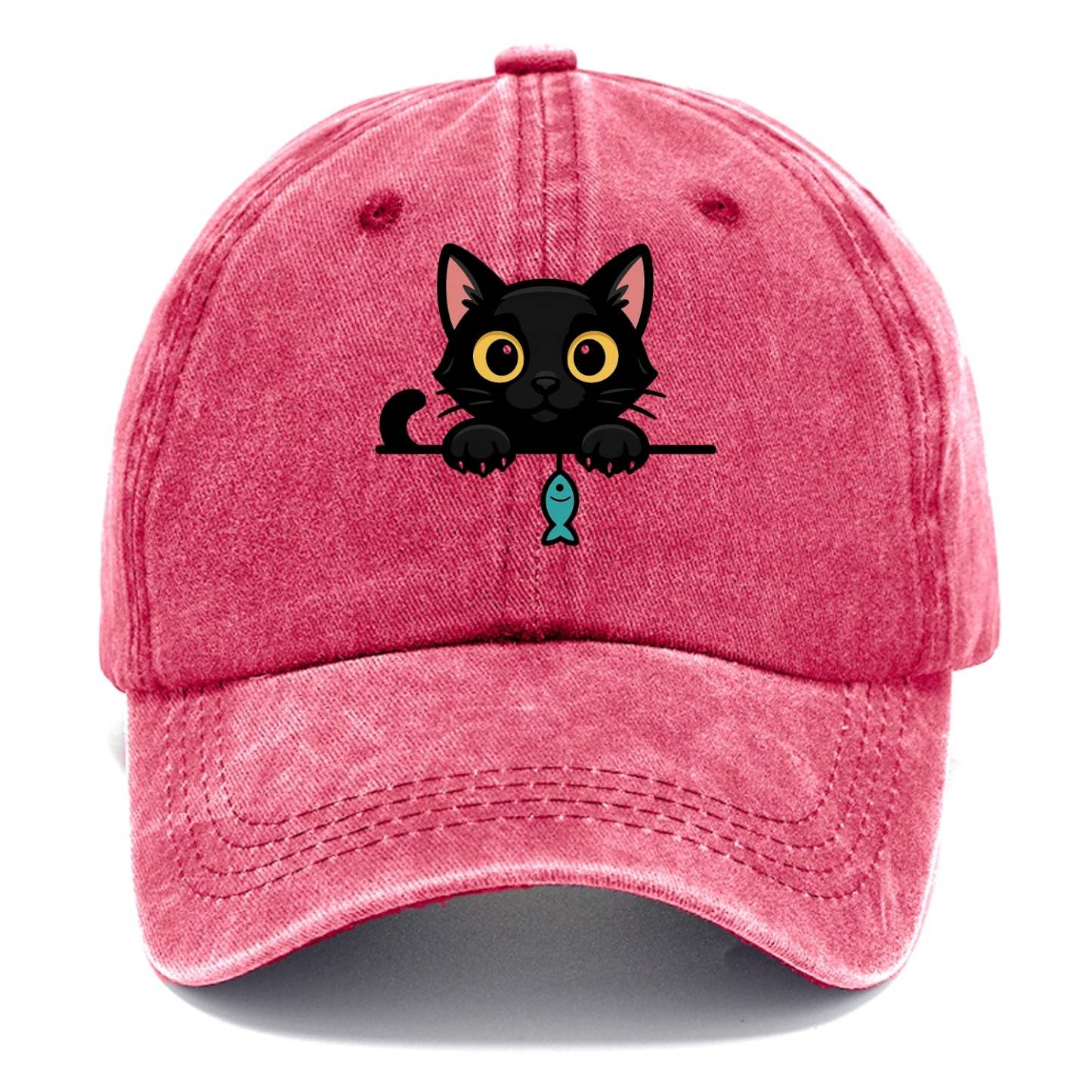 Midnight the black cat holding a tiny yarn ball between both paws while peeking Washed Cap