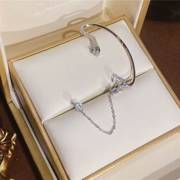 Diamond-studded snake-shaped earrings