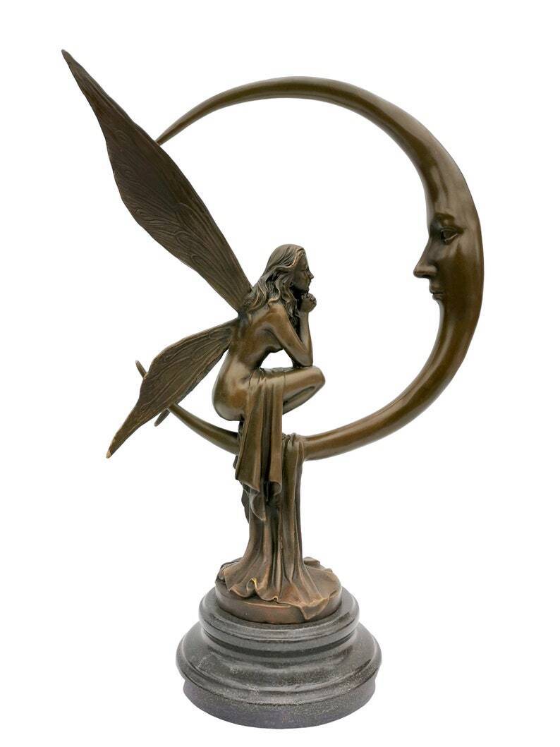 Amazing bronze sculpture of a bronze fairy sitting on the moon