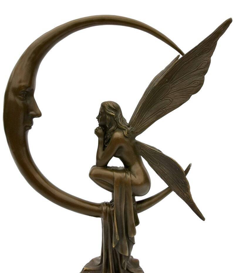 Amazing bronze sculpture of a bronze fairy sitting on the moon