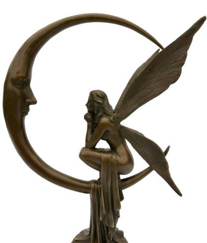 Amazing bronze sculpture of a bronze fairy sitting on the moon