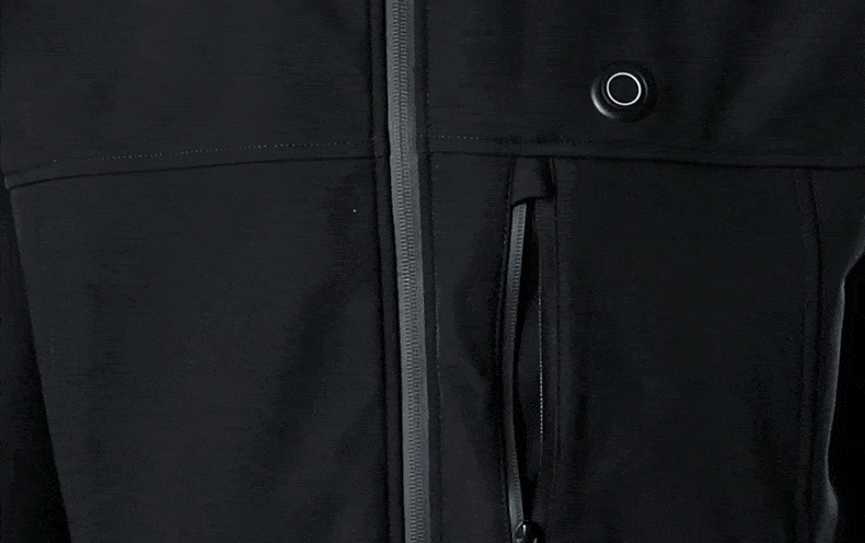 The capacity of the invisible zipper pocket on the chest is demonstrated by putting an iPhone in it for demonstration