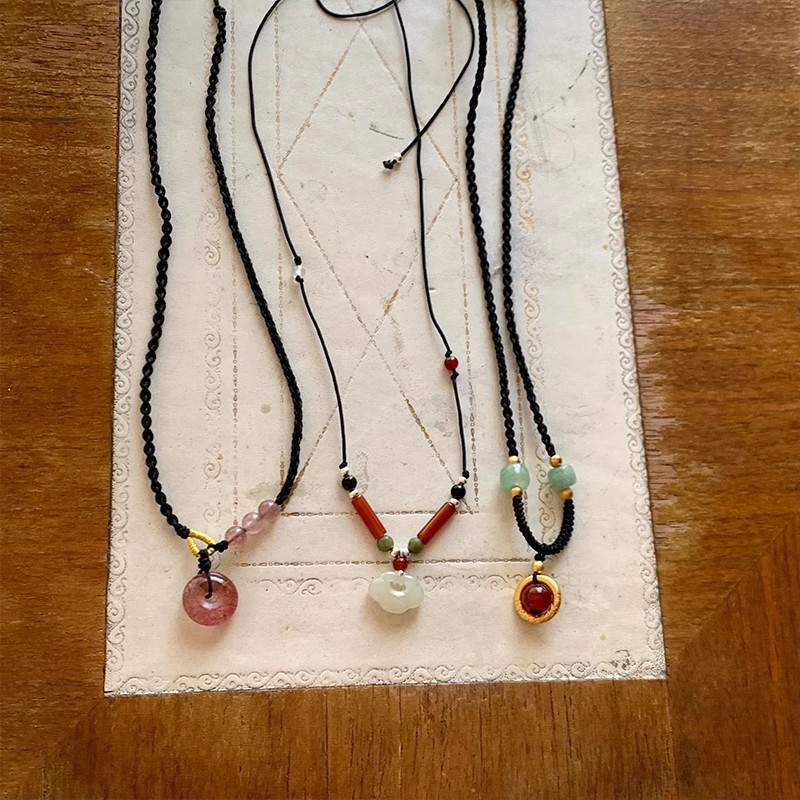 Black Cord as Paper, Gemstones as Ink—An Eastern Poem for the Neck