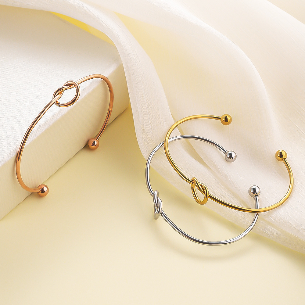 Layered Knot Cuff Bracelets: A Symphony of Shimmer