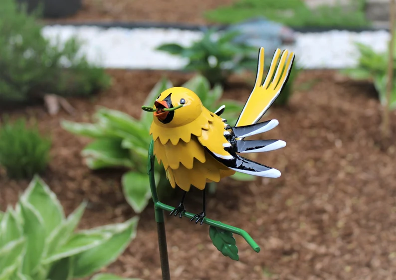 Goldfinch, Cardinal, Western Bluebird, Ruby-throated Hummingbird on a garden stake