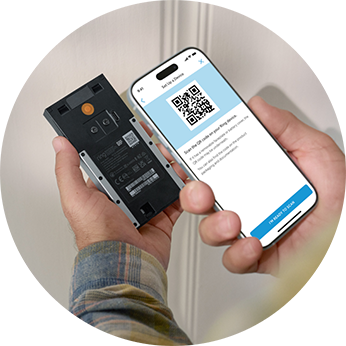 1) A person is scanning a QR code using a mobile phone.