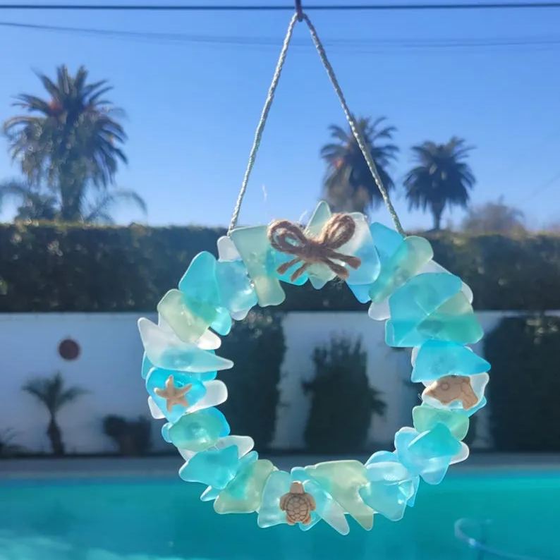 Sea Glass Summer wreath light blue, seafoam green and white embleshed with howlite star fish,sea turtle and dolphin Hangs from matching rope