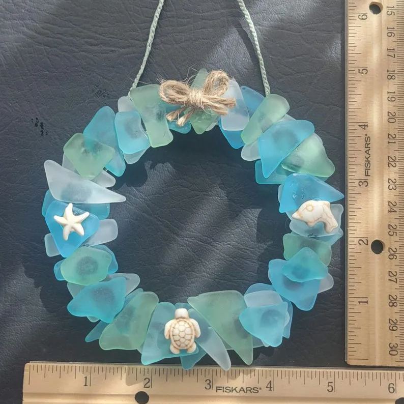 Sea Glass Summer wreath light blue, seafoam green and white embleshed with howlite star fish,sea turtle and dolphin Hangs from matching rope