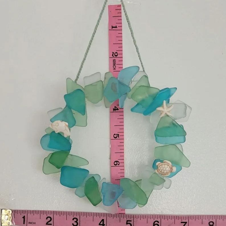 Sea Glass Summer wreath light blue, seafoam green and white embleshed with howlite star fish,sea turtle and dolphin Hangs from matching rope