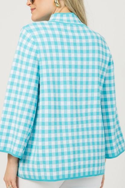 Loose-fitting blue and white checkered top