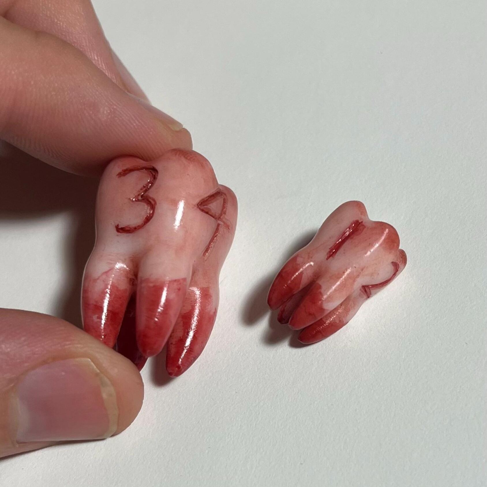 Replica life-sized Molar 4-sided dice prop for ttrpg and DnD