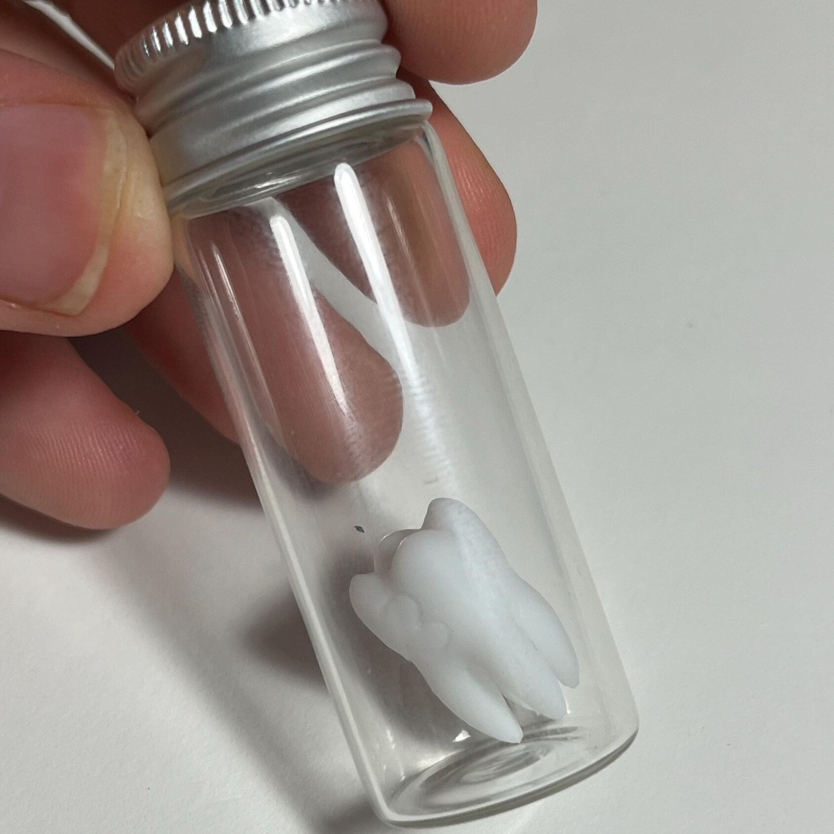 Replica life-sized Molar 4-sided dice prop for ttrpg and DnD