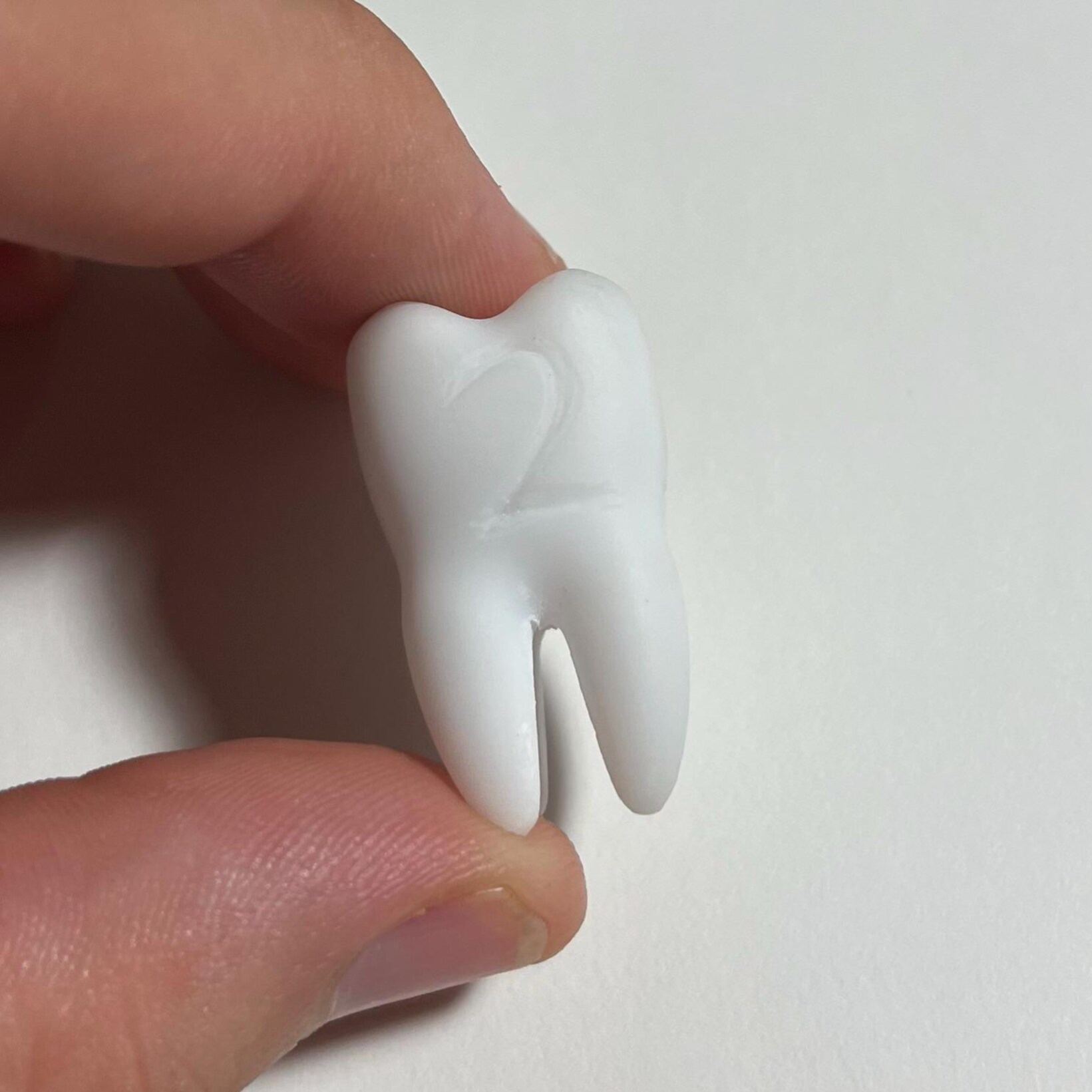 Replica life-sized Molar 4-sided dice prop for ttrpg and DnD