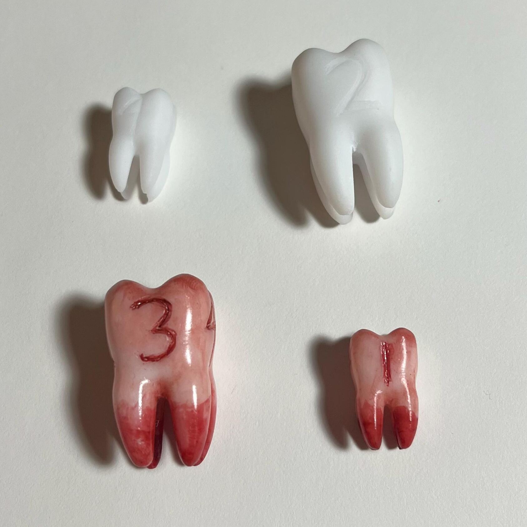 Replica life-sized Molar 4-sided dice prop for ttrpg and DnD