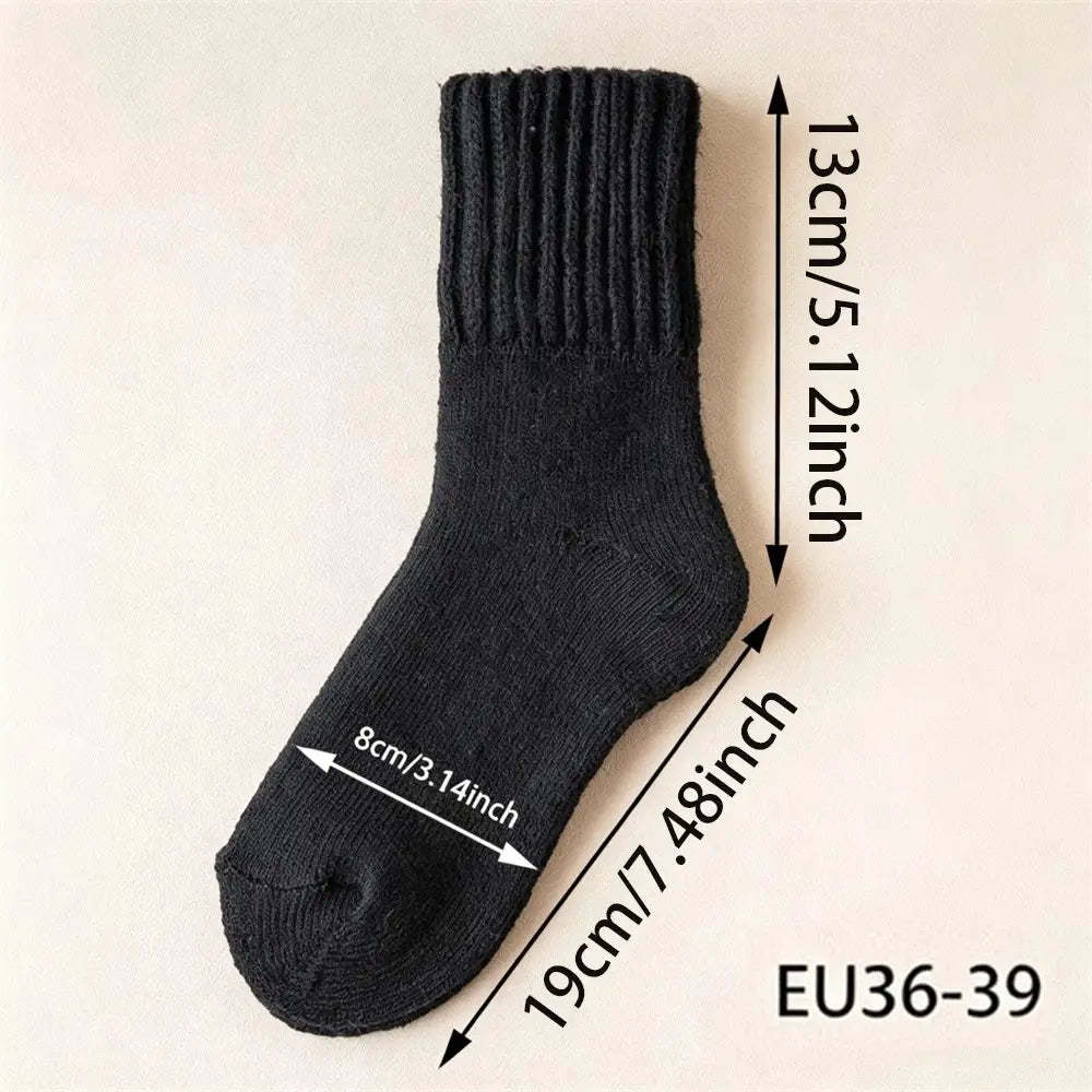 A single black ribbed knit sock shown on a light beige background with overlaid dimension arrows and text indicating measurements: 13 cm / 5.12 inch height, 19 cm / 7.