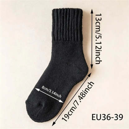 A single black ribbed knit sock shown on a light beige background with overlaid dimension arrows and text indicating measurements: 13 cm / 5.12 inch height, 19 cm / 7.