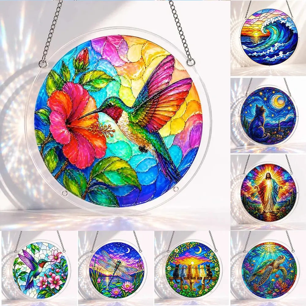 A collection display of round stained glass suncatchers hanging by chains showing hummingbird wave cat moon religion dragonfly turtle and other designs