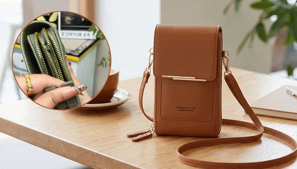 A brown leather crossbody phone bag on a wooden desk with a circular close up of an olive green bag and hand touching it