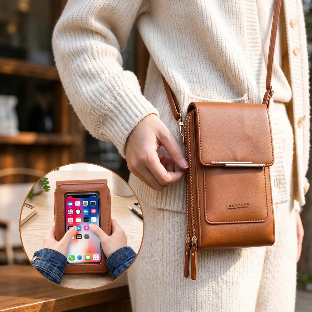 A person in a cream knit cardigan opening the zipper of a brown crossbody phone bag with a circular insert showing phone use