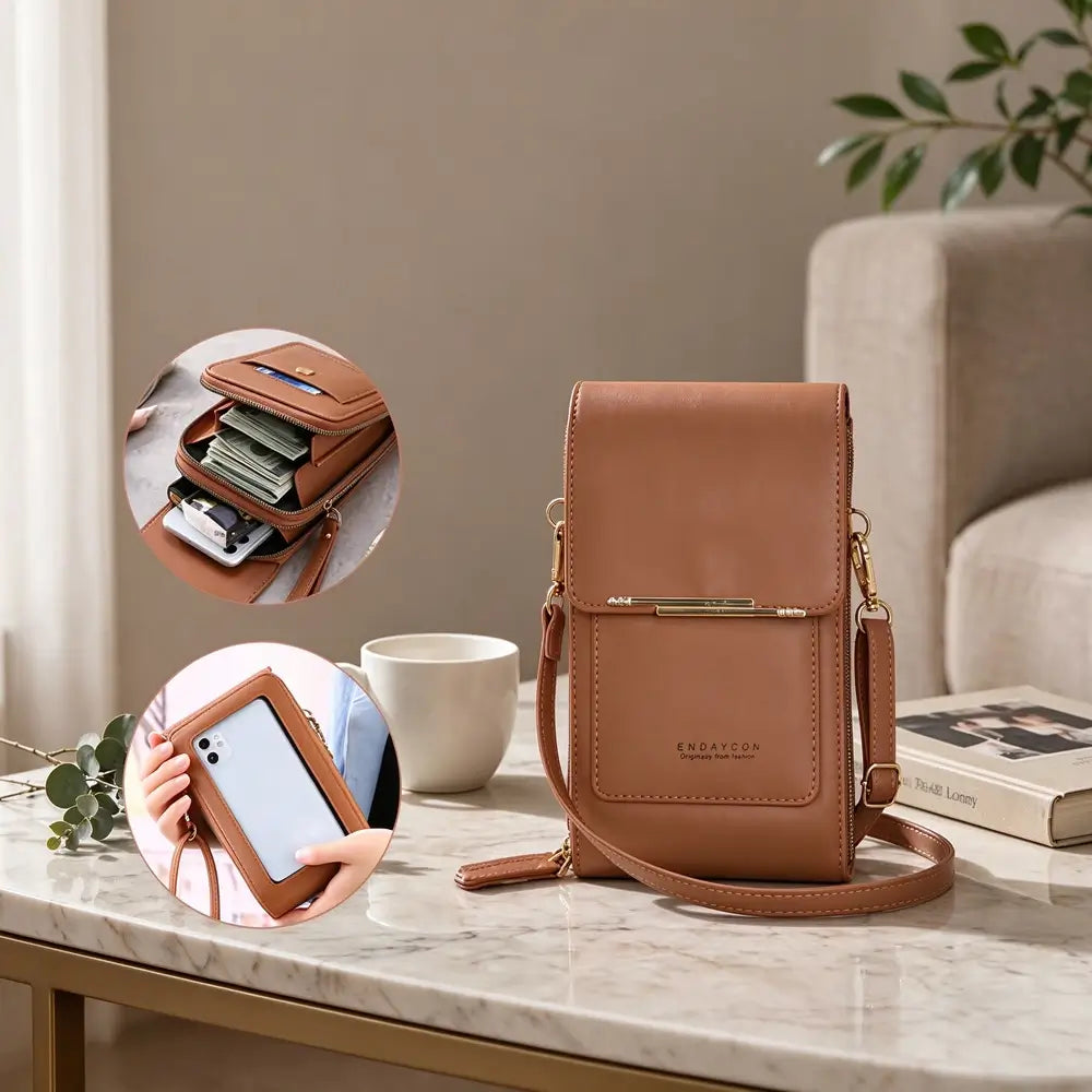 A brown leather crossbody phone bag on a marble table with circular details showing inner storage for cash cards and phone and the phone in the window slot