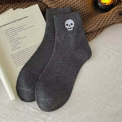 Halloween crew socks featuring an embroidered skull motif
