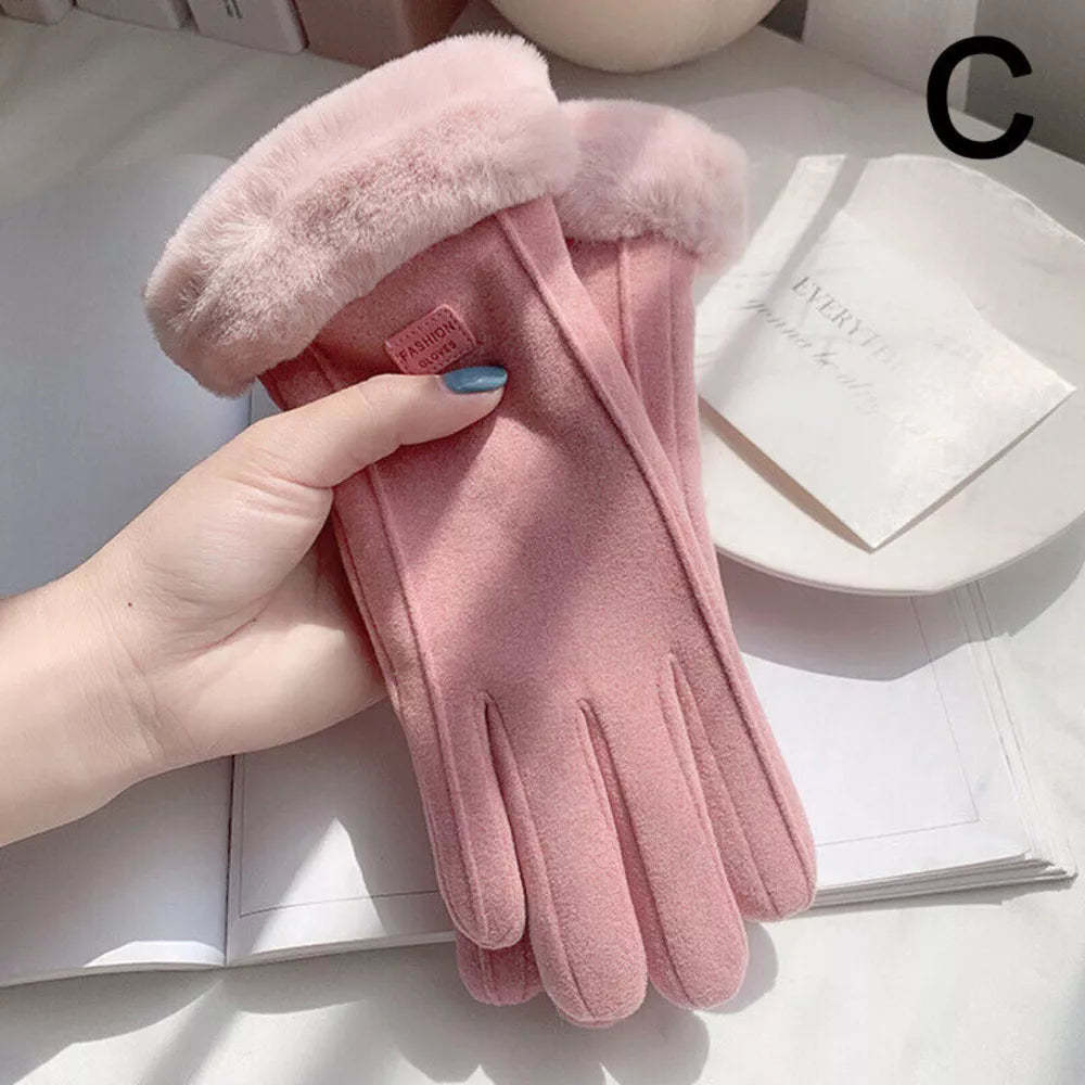 A pink faux-leather glove with a fluffy faux-fur cuff, held by a hand over an open book.