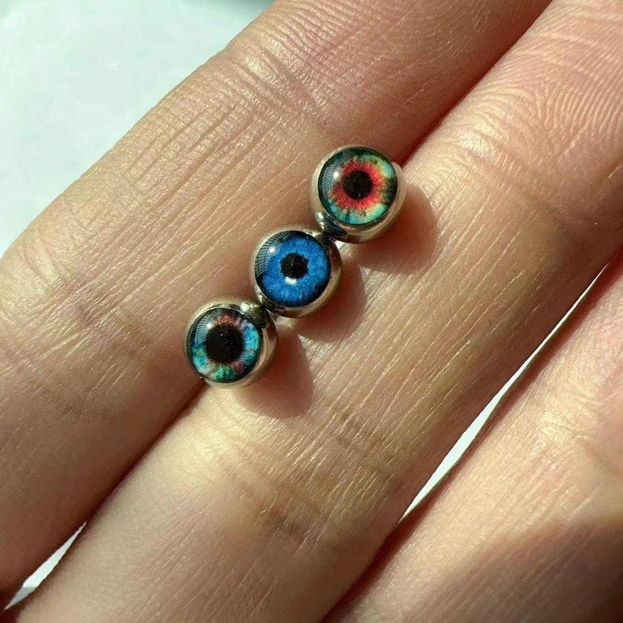 Magic Eye Coated Glasses, Tongue Studs, Titanium Steel