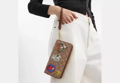 Coach X Peanuts Long Zip Around Wallet In Signature Canvas With Patches