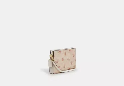 Slim Crossbody Bag In Signature Canvas With Floral Print