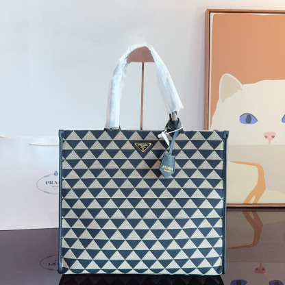 Symbole embroidered fabric handbag