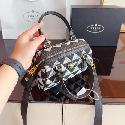 Symbole embroidered fabric top-handle bag