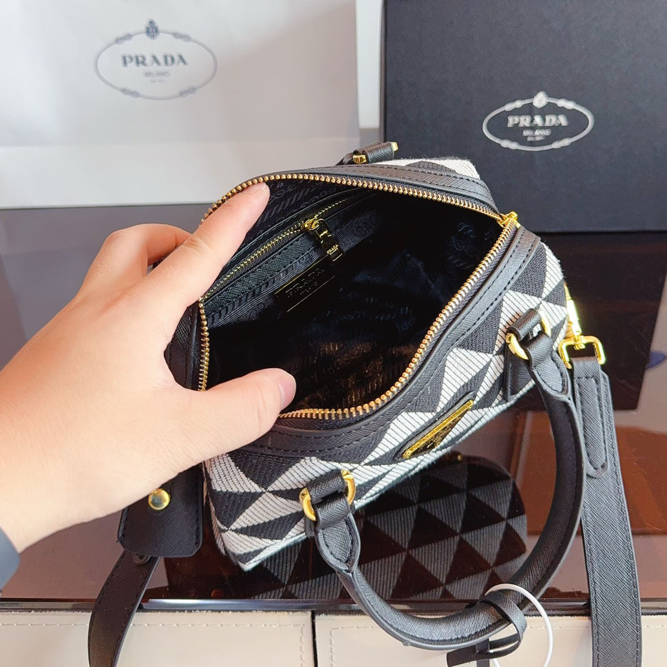 Symbole embroidered fabric top-handle bag