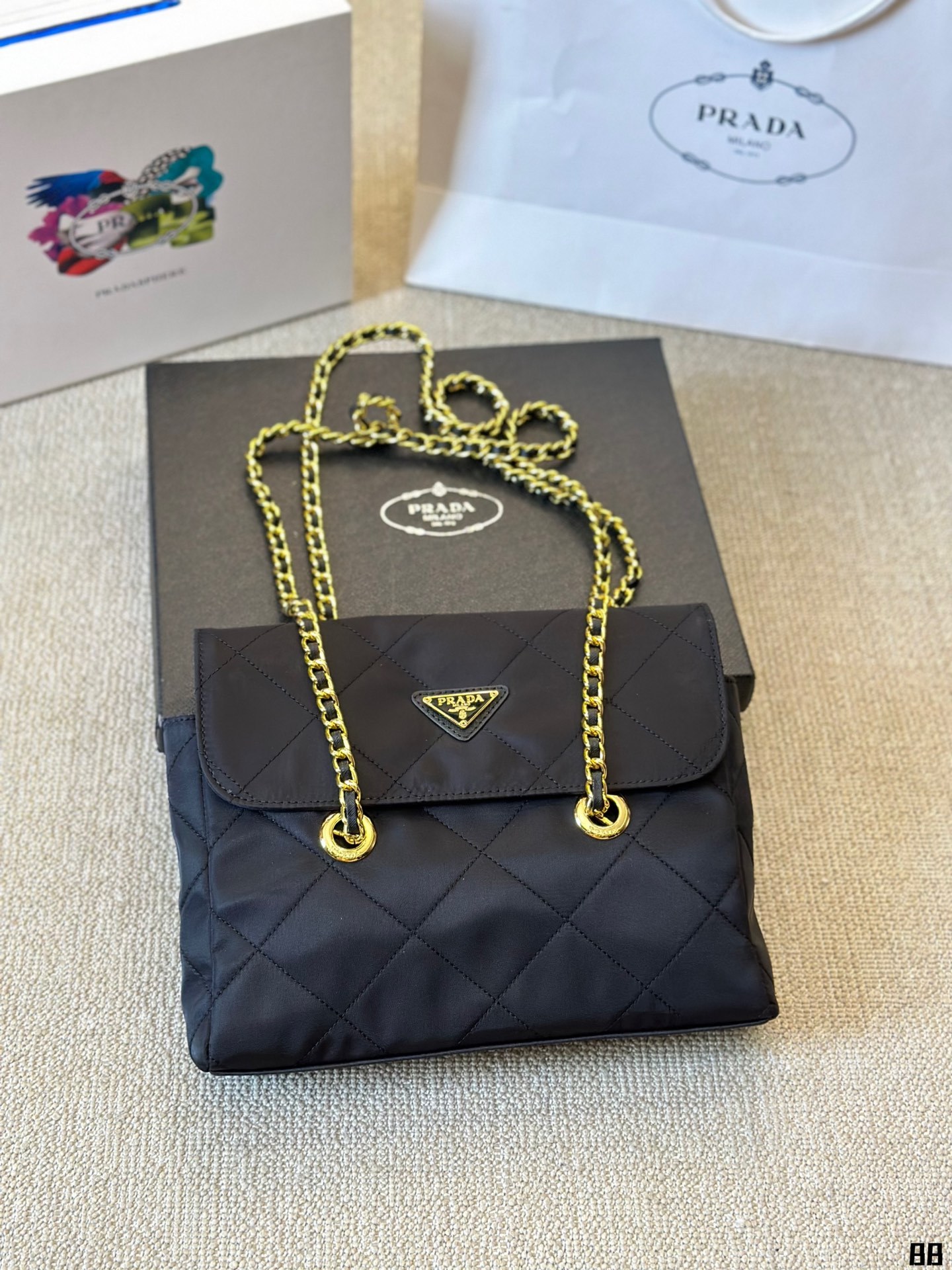 Enamel triangle logo quilted handbag