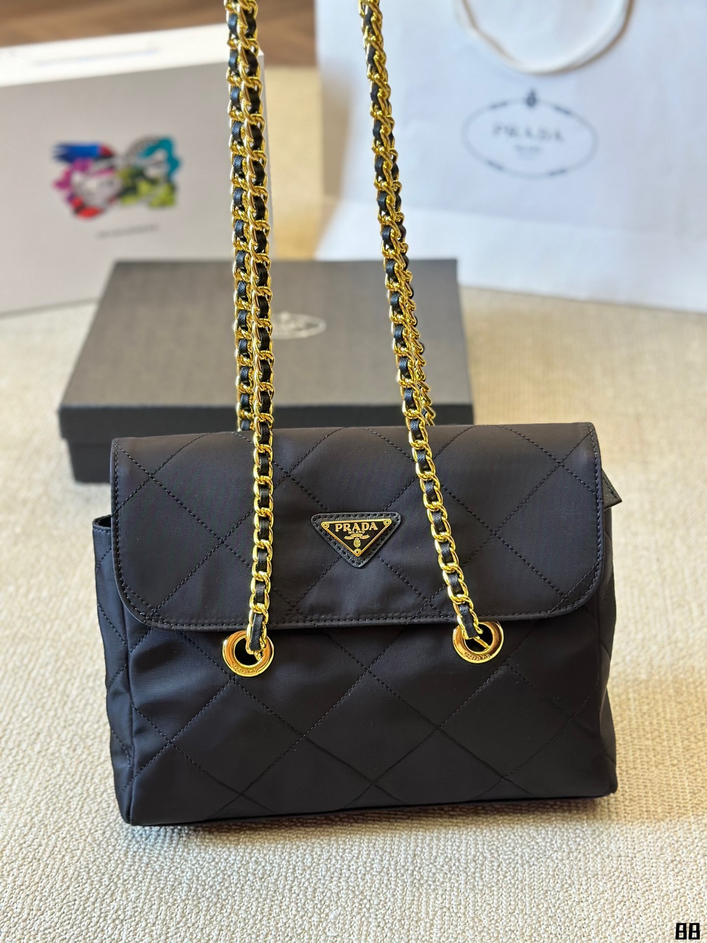 Enamel triangle logo quilted handbag