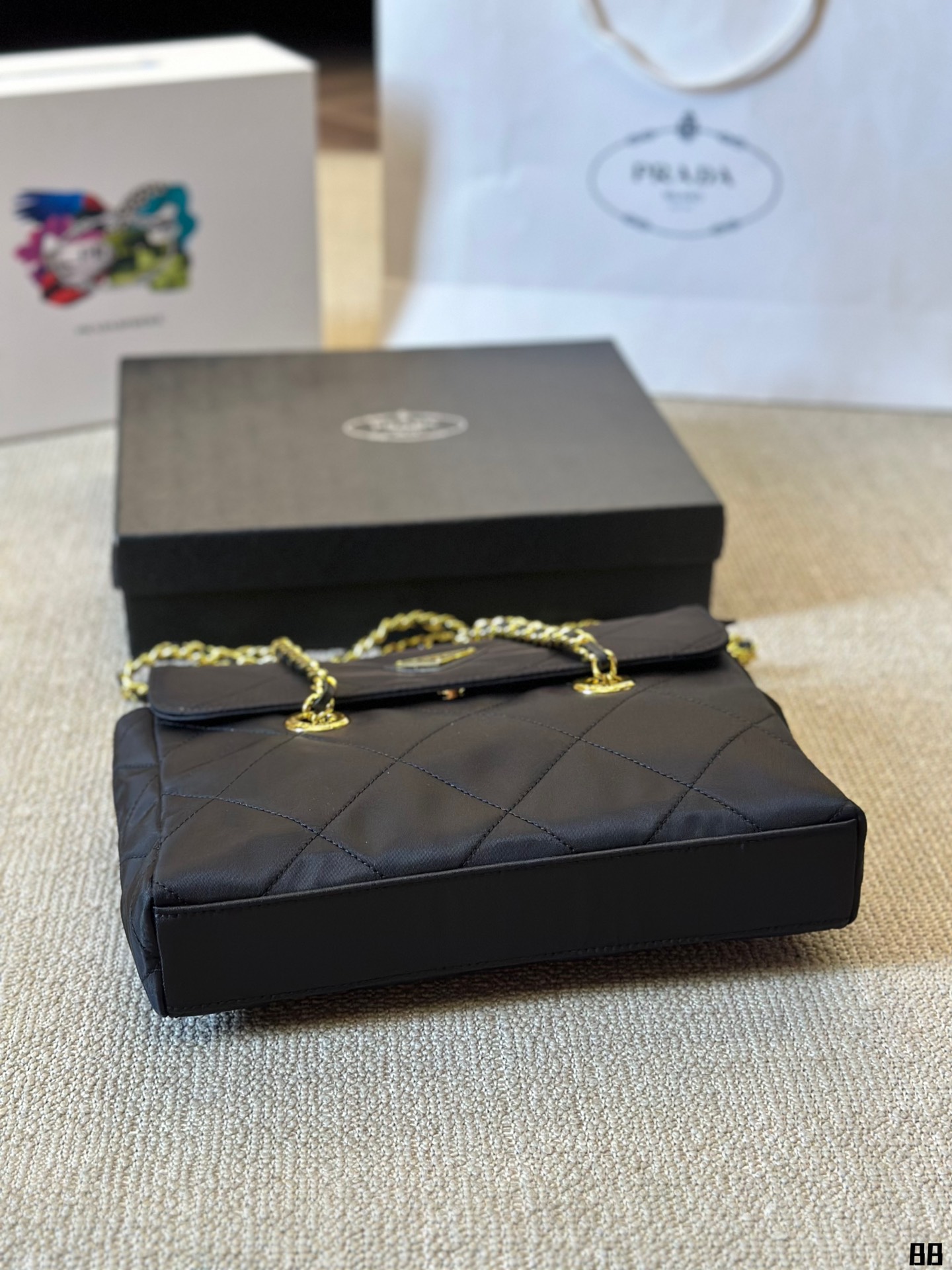 Enamel triangle logo quilted handbag