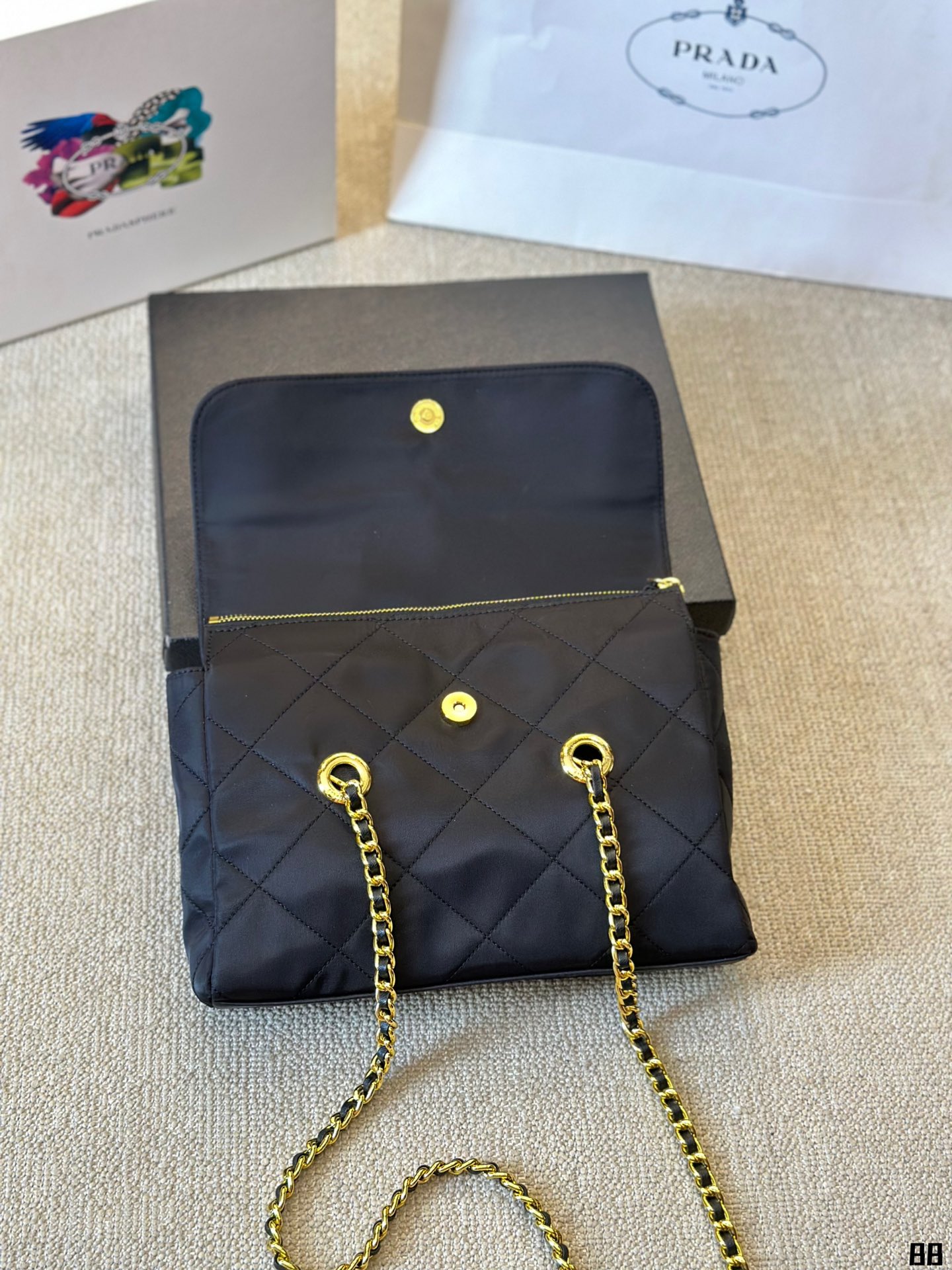 Enamel triangle logo quilted handbag