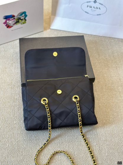 Enamel triangle logo quilted handbag