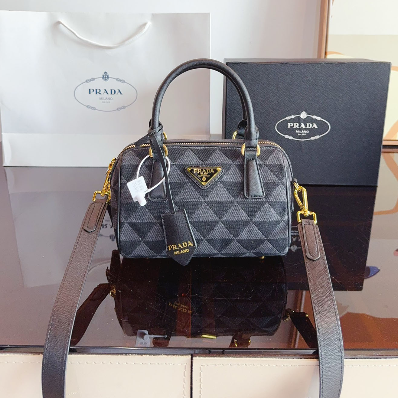 Symbole embroidered fabric top-handle bag