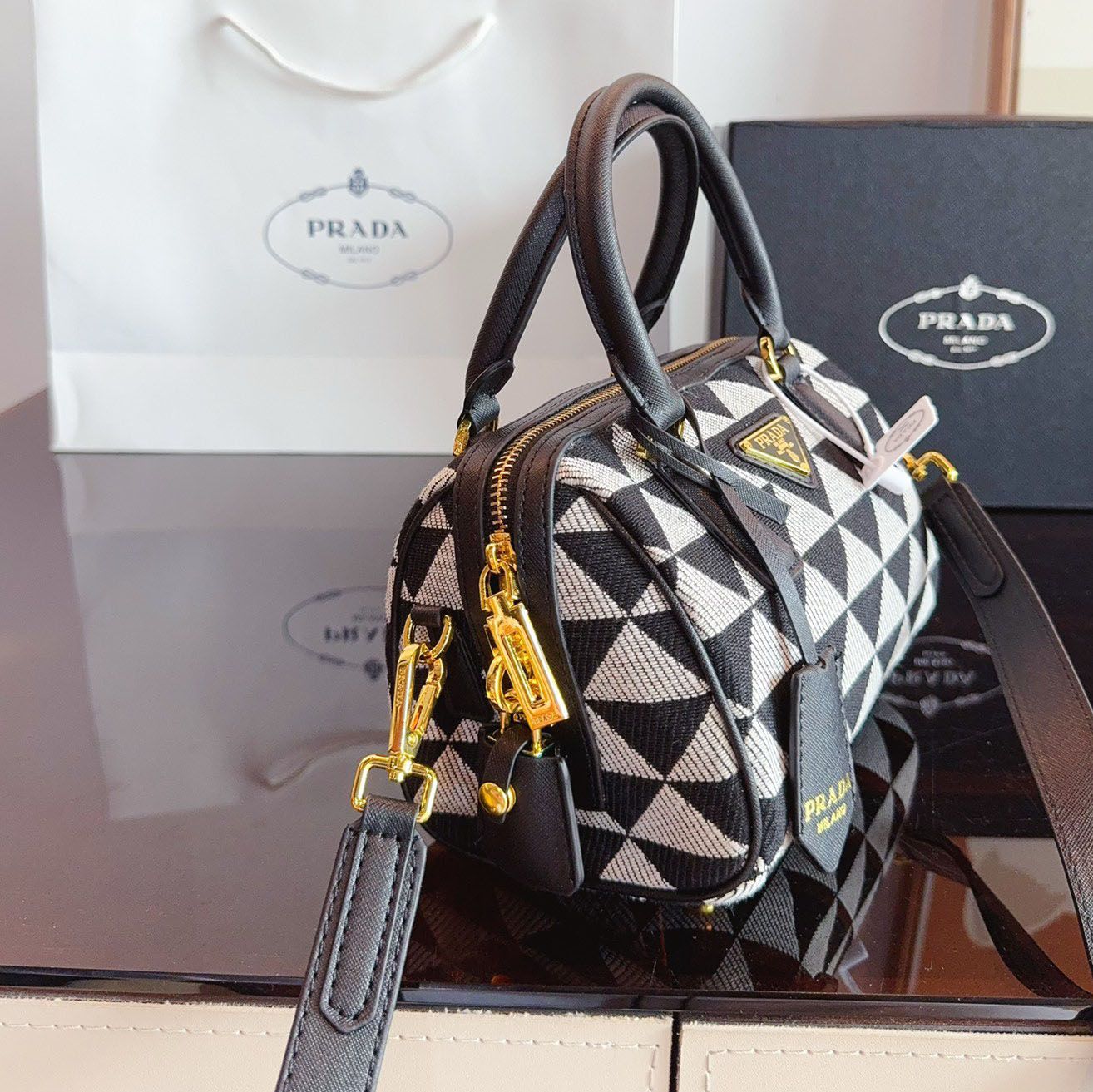 Symbole embroidered fabric top-handle bag