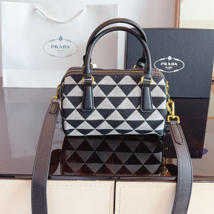 Symbole embroidered fabric top-handle bag