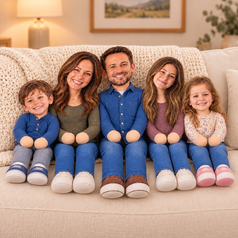 Five personalized family photo dolls together on a sofa