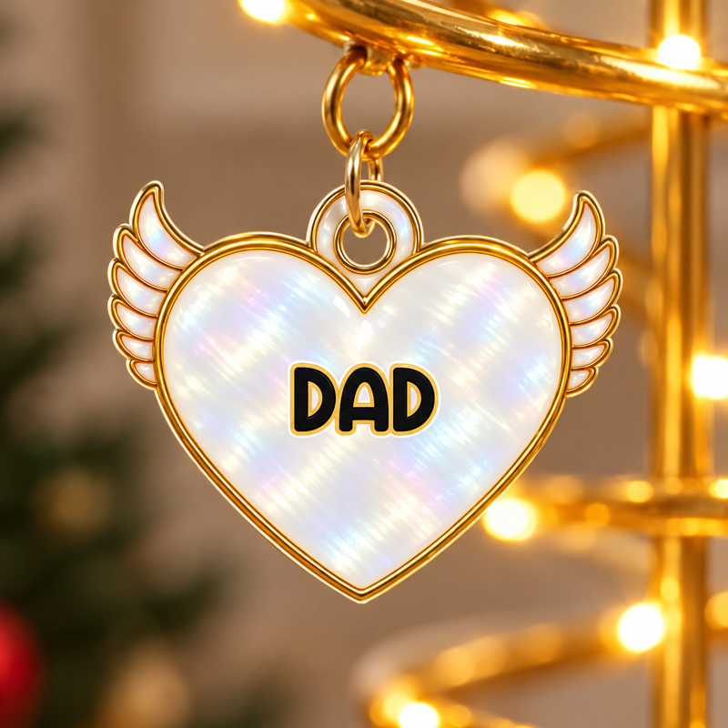 Close view of the personalised DAD winged heart charm on the Christmas tree light.
