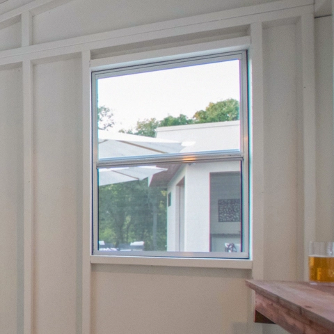 Operable Window with Screen Close-up of the operable window inside shed.