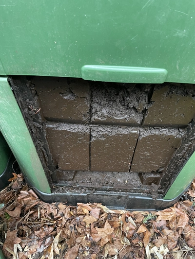 Back of Access Door Imprinted Itself Into Fresh Compost